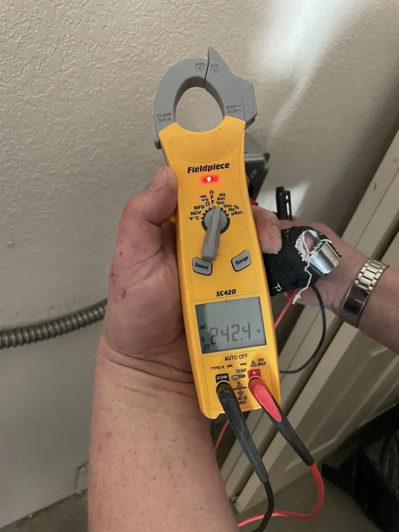 Voltage testing with clamp meter during Outlet Installation in Sanger